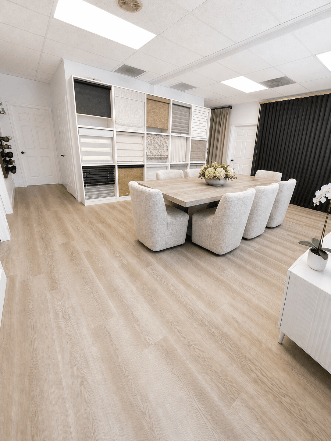 A range of window treatments displayed in a bright Sarasota showroom-style living space