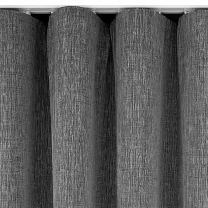 Close-up of gray textured ripplefold wave drapery hanging in uniform S-folds on a track