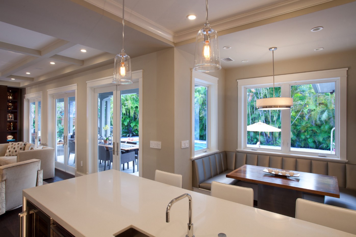 Bright kitchen with PGT WinGuard aluminum casement windows over the counter