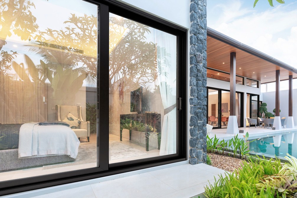 Black-framed PGT WinGuard vinyl Shadowlight sliding glass door