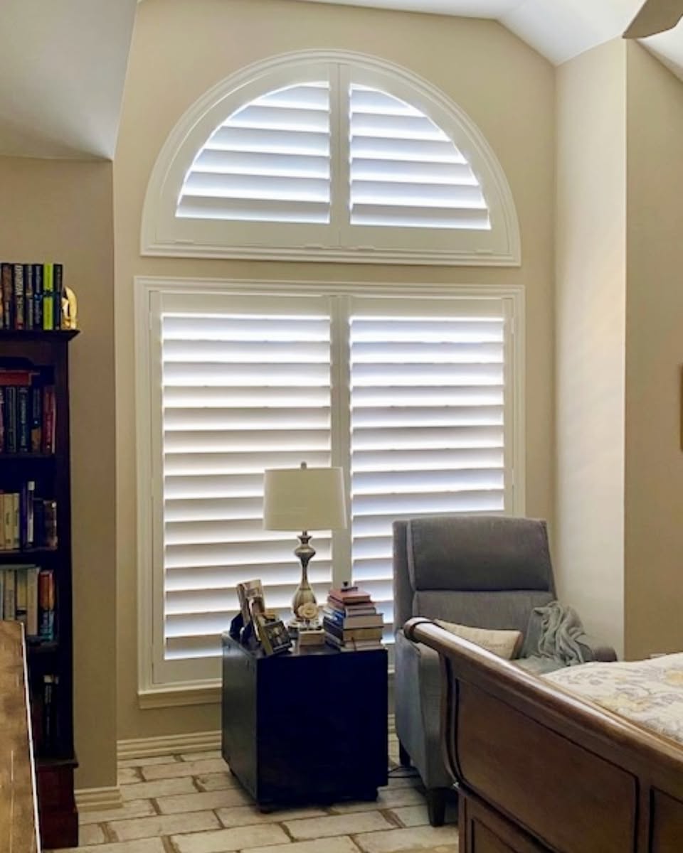 Kitchen and living space in Cobblestone on Palmer Ranch, Sarasota, with plantation shutters by Sarasota Window Blinds