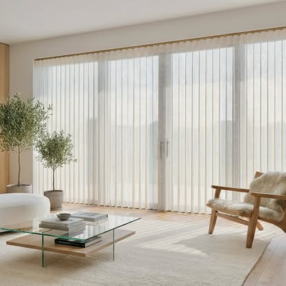 Sheer SmartDrape vertical panels covering a wall of sliding glass doors in a bright, neutral living room